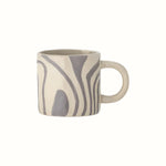 Grey and neutral glazed mug with a retro swirl pattern and small handle.