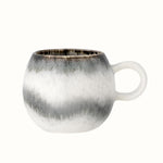 Small mug with handle in white and grey reactive glaze.