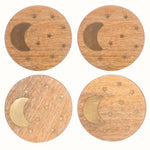 Set of 4 round mango wood coasters with crescent and star brass inlay detailing.