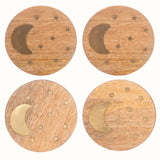 Set of 4 round mango wood coasters with crescent and star brass inlay detailing.